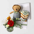 Leo baby hamper set with zig zag knit blanket and fresh flowers in glass vase in white gift box Geelong delivery