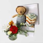 Leo baby hamper set with zig zag knit blanket and fresh flowers in glass vase in white gift box Geelong delivery